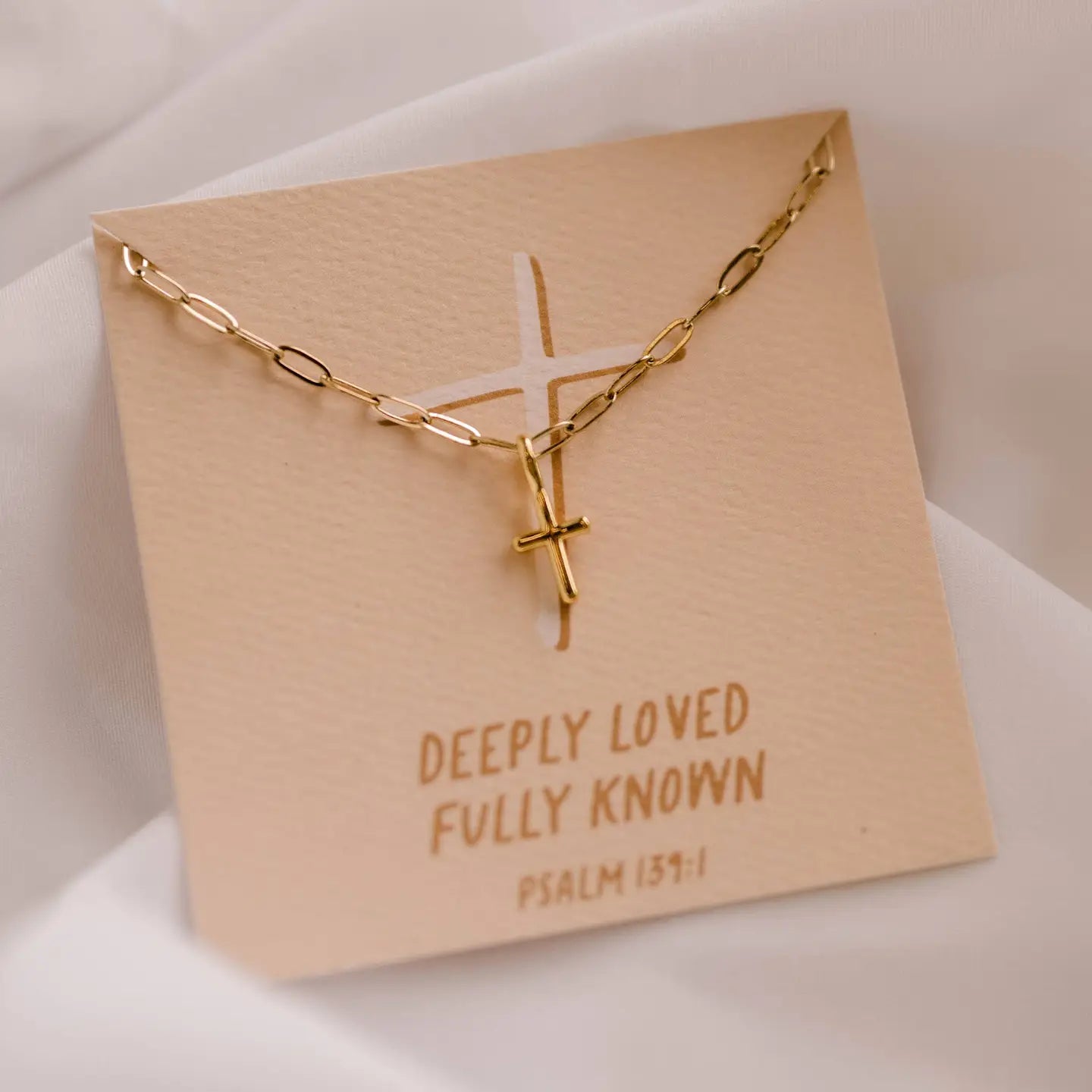 'DEEPLY LOVED' GOLD CROSS NECKLACE